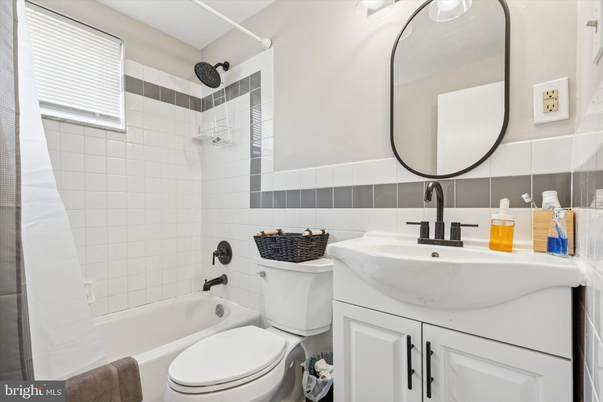 120 Clement Road Oreland, PA 19075 - Photo 19 of 34 a bathroom with a sink a toilet and a mirror