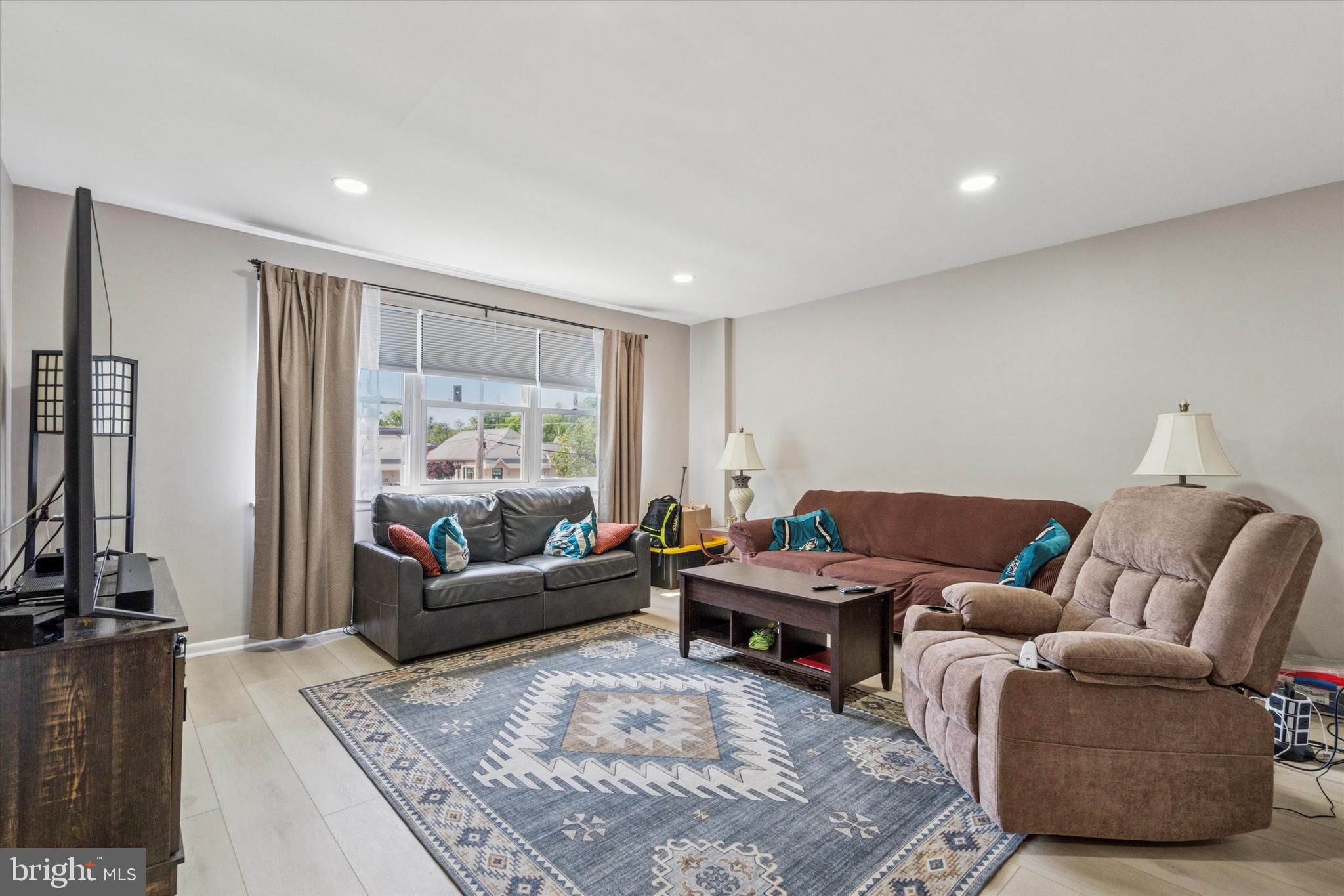 120 Clement Road Oreland, PA 19075 - Photo 2 of 34 a living room with furniture and a large window