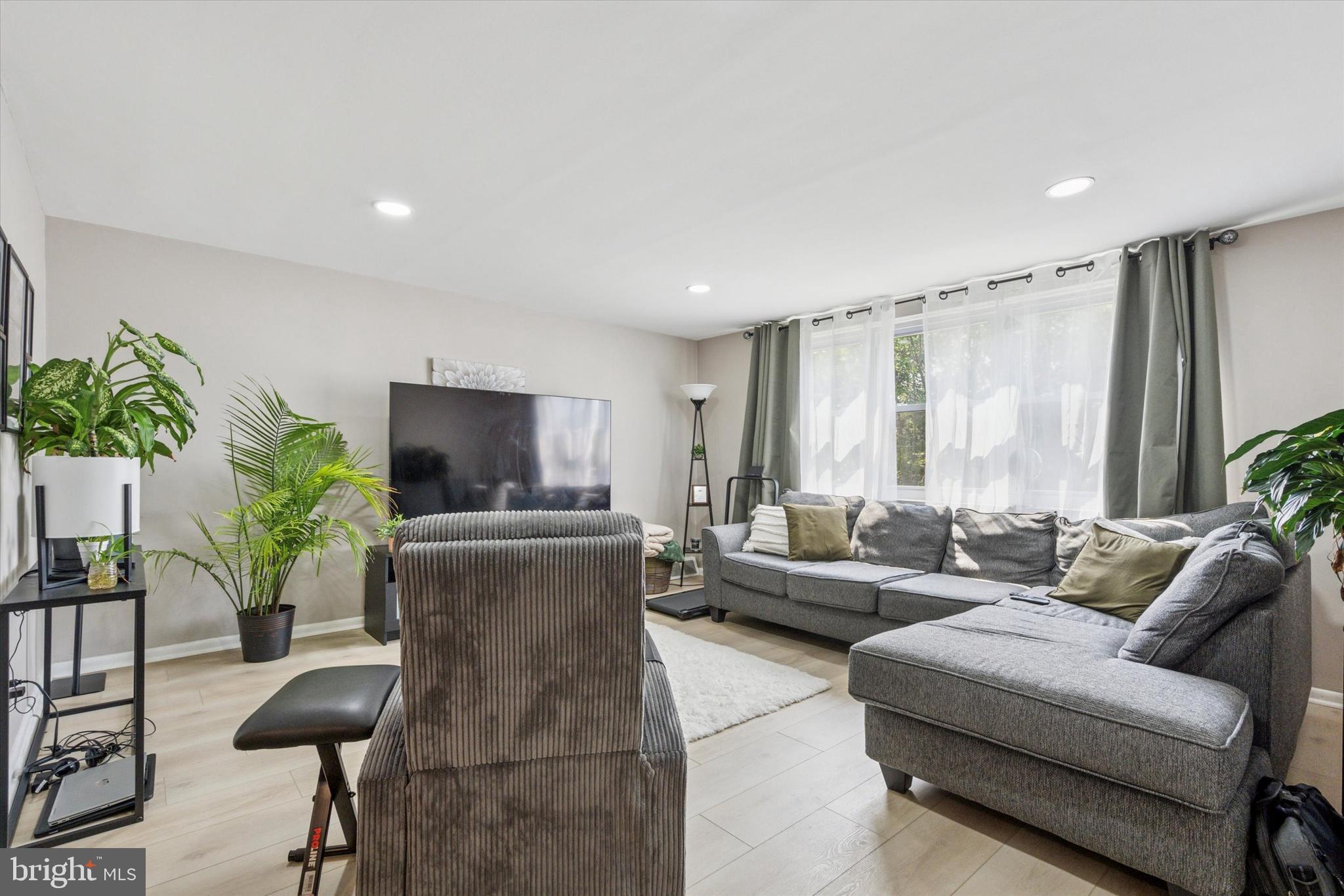 120 Clement Road Oreland, PA 19075 - Photo 22 of 34 a living room with furniture and a flat screen tv
