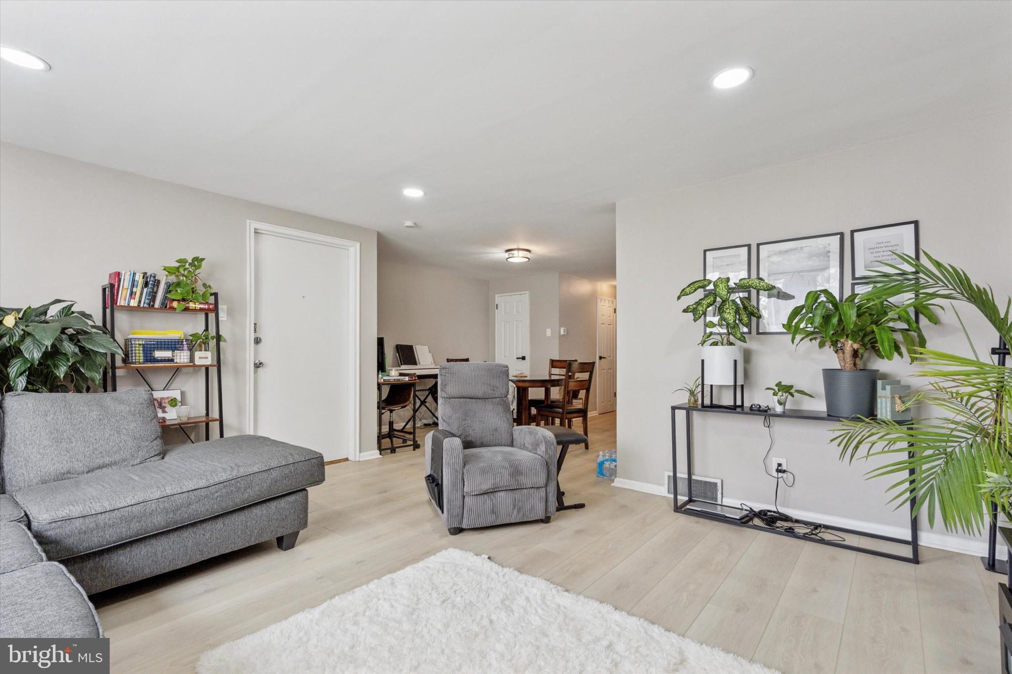 120 Clement Road Oreland, PA 19075 - Photo 23 of 34 a living room with furniture and a potted plant