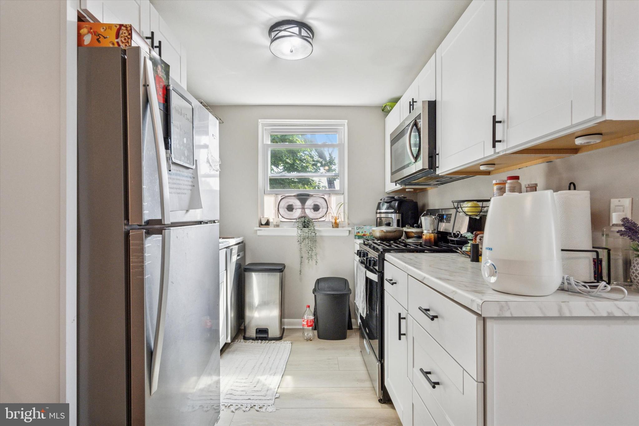 120 Clement Road Oreland, PA 19075 - Photo 25 of 34 a kitchen with stainless steel appliances granite countertop a refrigerator sink and cabinets