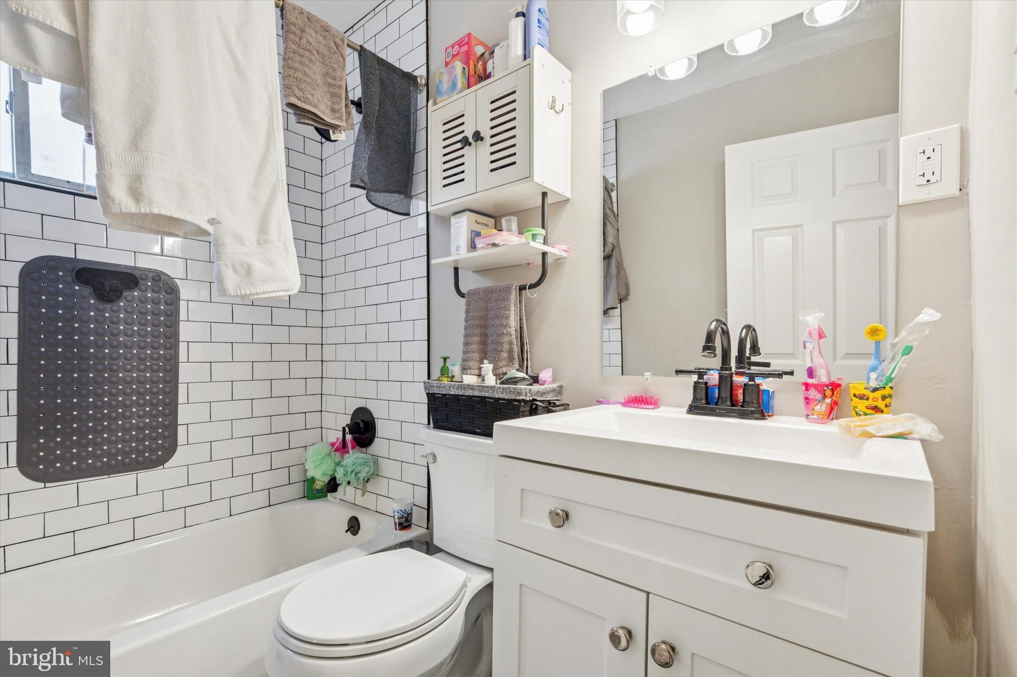 120 Clement Road Oreland, PA 19075 - Photo 6 of 34 a bathroom with a sink vanity mirror bathtub and toilet