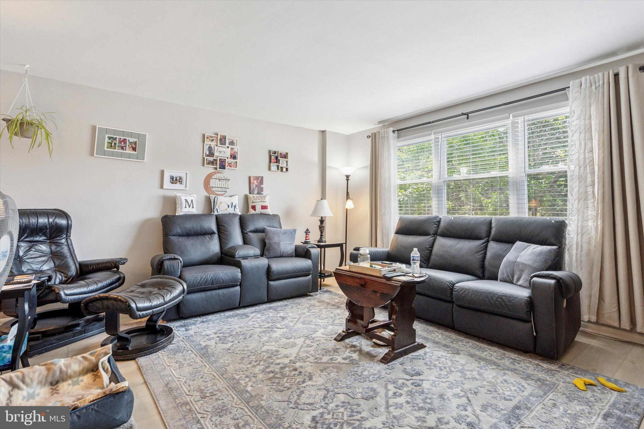120 Clement Road Oreland, PA 19075 - Photo 8 of 34 a living room with furniture a rug and a large window