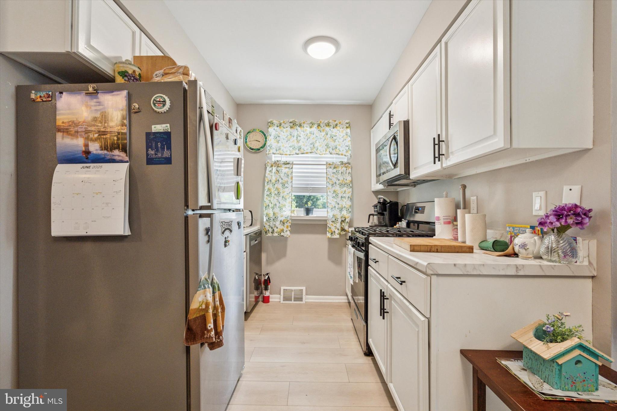 120 Clement Road Oreland, PA 19075 - Photo 9 of 34 a kitchen with a sink stove and refrigerator