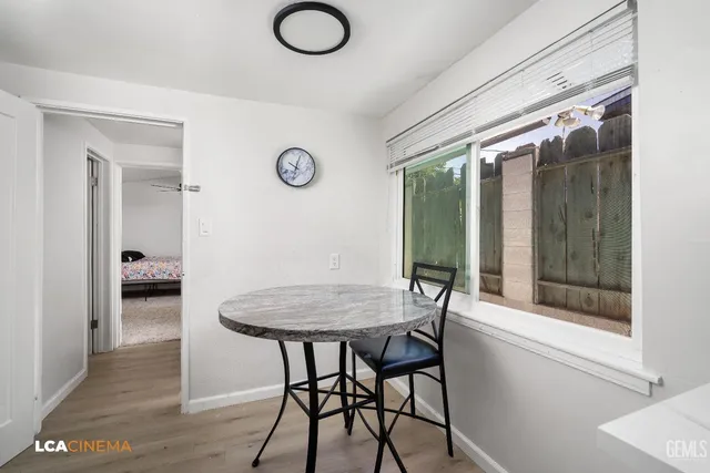 a view of a room with furniture and window