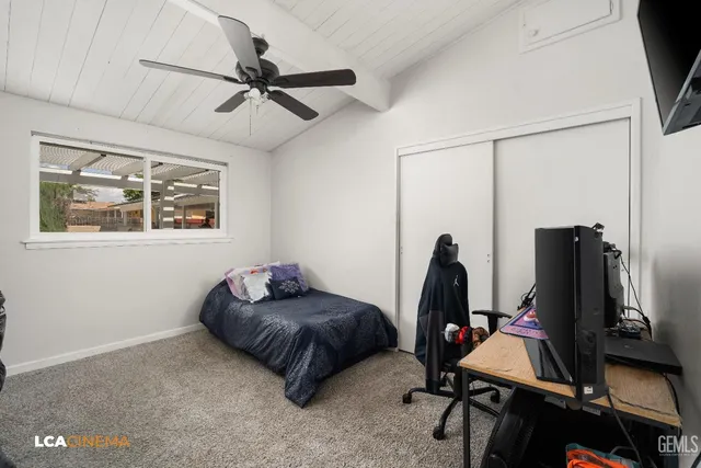 a bedroom with furniture and a window