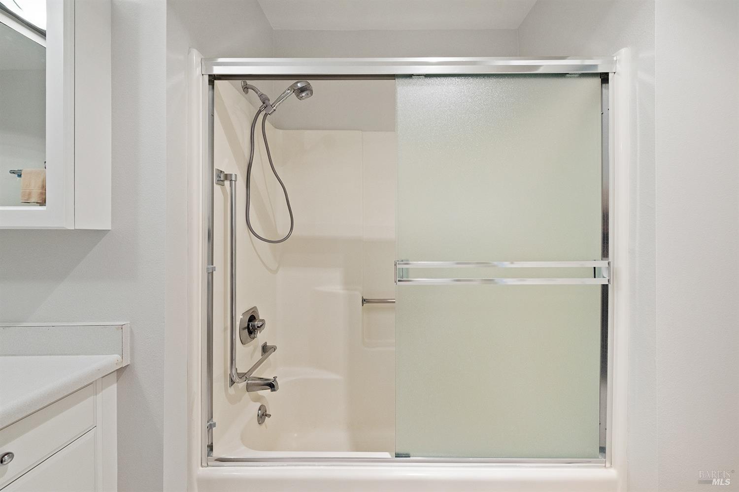 100 Thorndale Drive, Unit 106 San Rafael, CA 94903 - Photo 14 of 30 a bathroom with a glass shower door