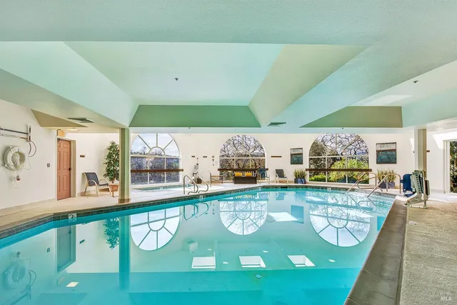 a view of a swimming pool with seating area