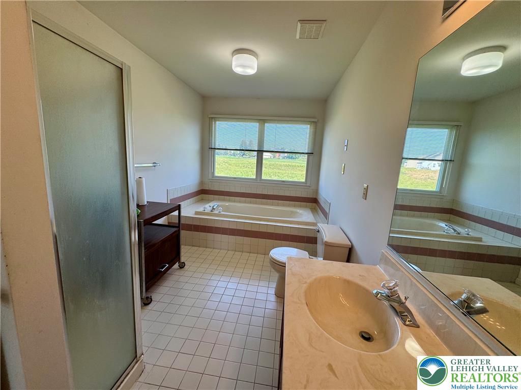 255 Ridings Circle Macungie, PA 18062 - Photo 19 of 30 a bathroom with a sink toilet and tub