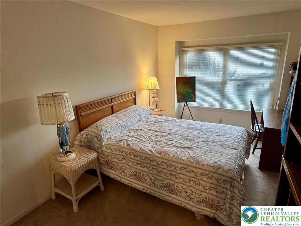 255 Ridings Circle Macungie, PA 18062 - Photo 20 of 30 a bedroom with a bed window and a table