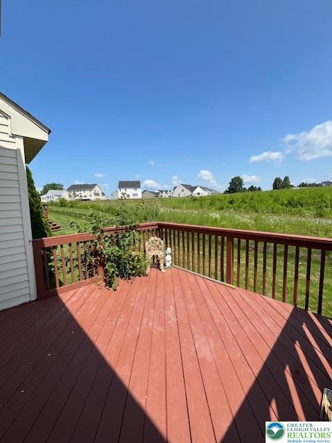 255 Ridings Circle Macungie, PA 18062 - Photo 27 of 30 a view of balcony with wooden floor and lake view