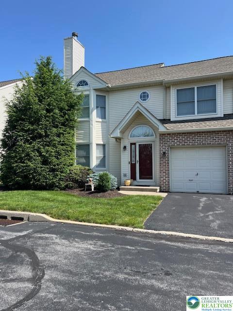 255 Ridings Circle Macungie, PA 18062 - Photo 3 of 30 a front view of a house with a yard and garage