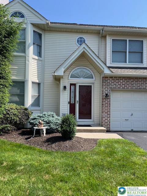 255 Ridings Circle Macungie, PA 18062 - Photo 4 of 30 a front view of a house with a garden and plants