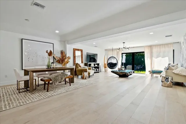 a view of a livingroom with furniture and a window