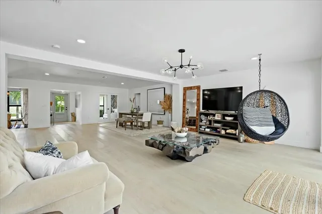 a view of living room with furniture and flat screen tv