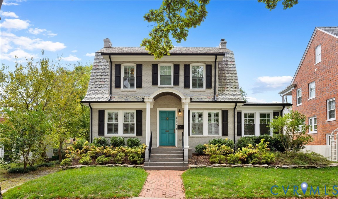 front view of a house with a yard
