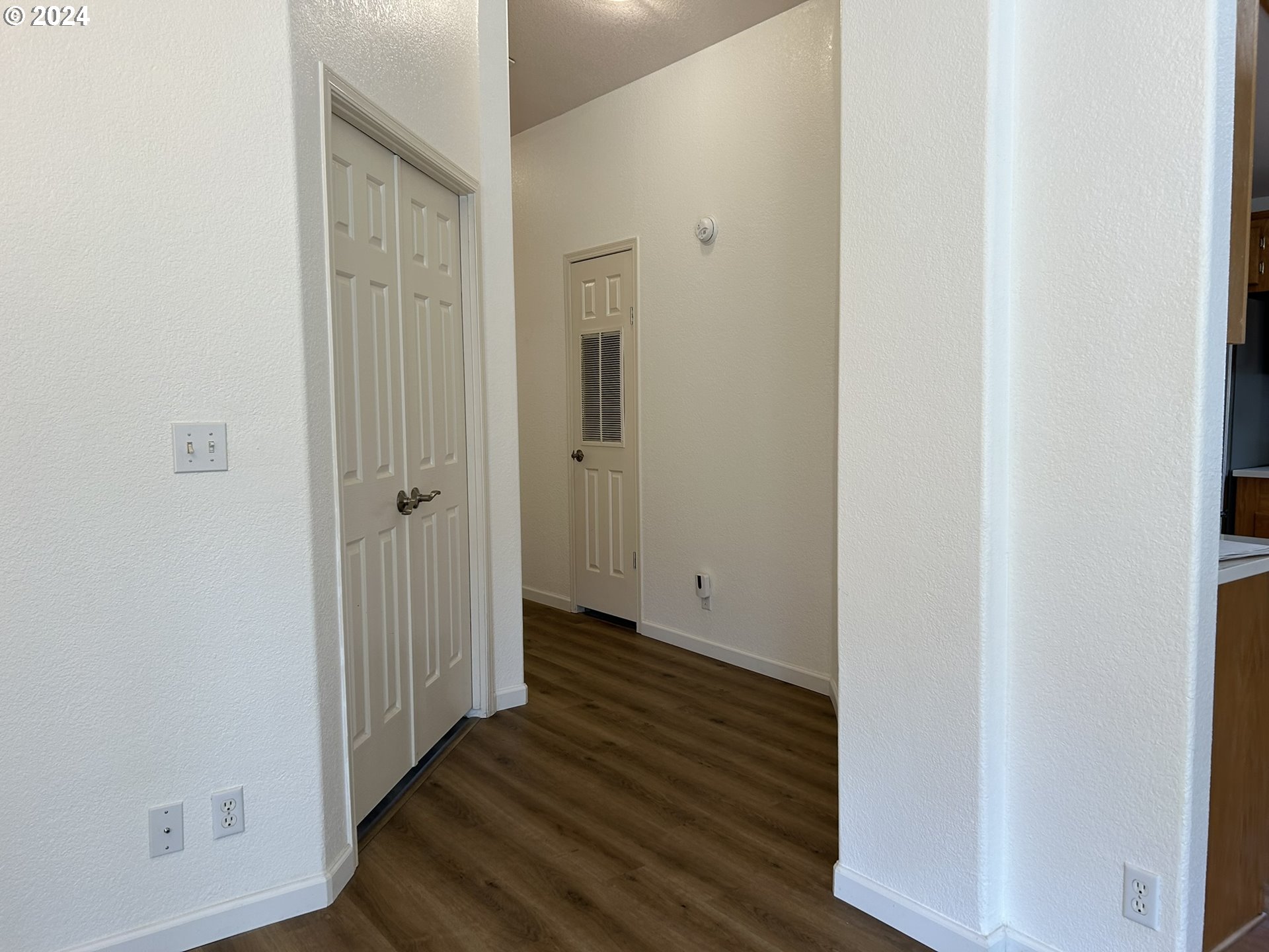 853 Munsel Creek Loop Florence, OR 97439 - Photo 15 of 44 a view of a hallway with wooden floor