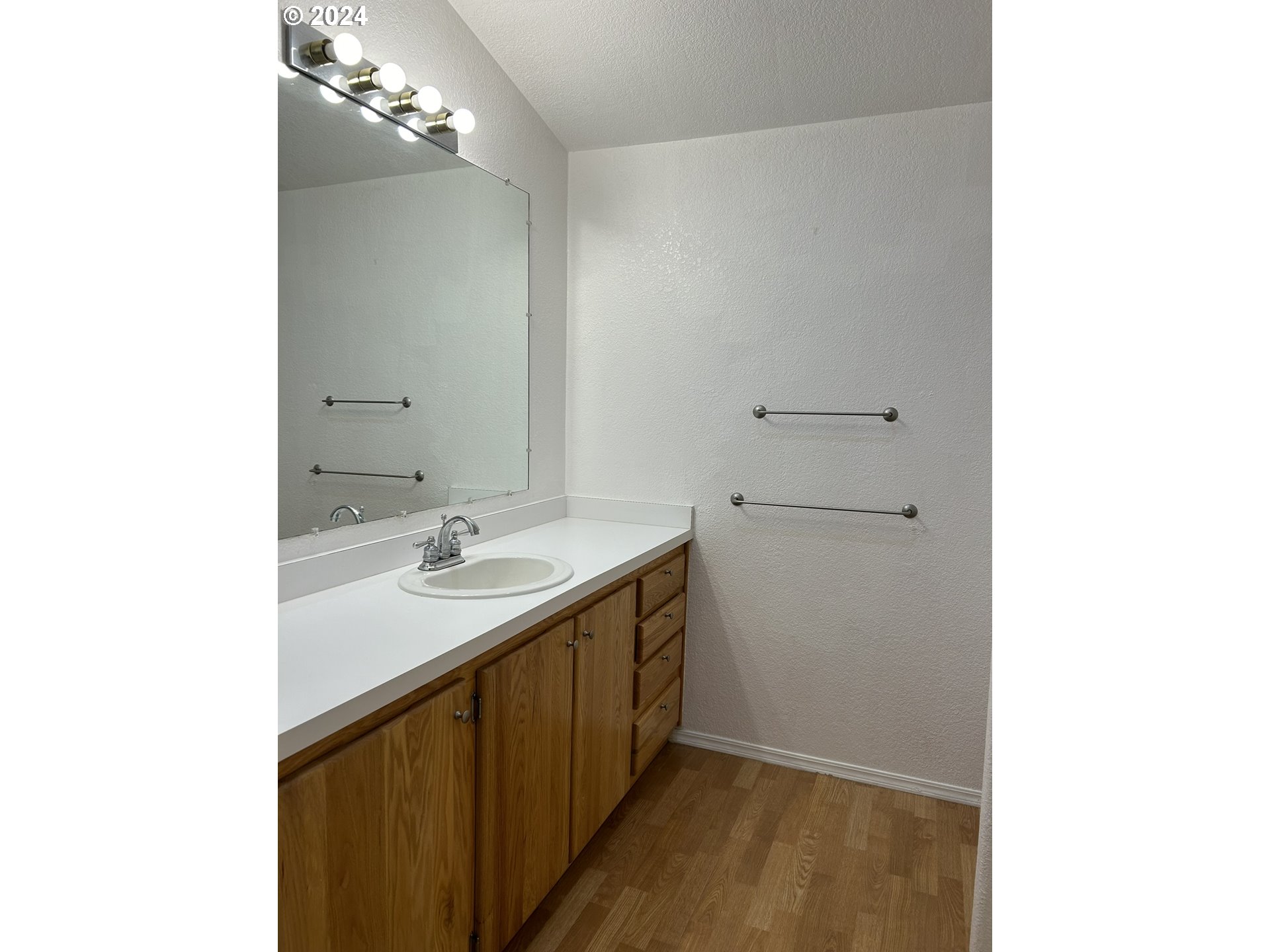 853 Munsel Creek Loop Florence, OR 97439 - Photo 21 of 44 a bathroom with a sink and a mirror
