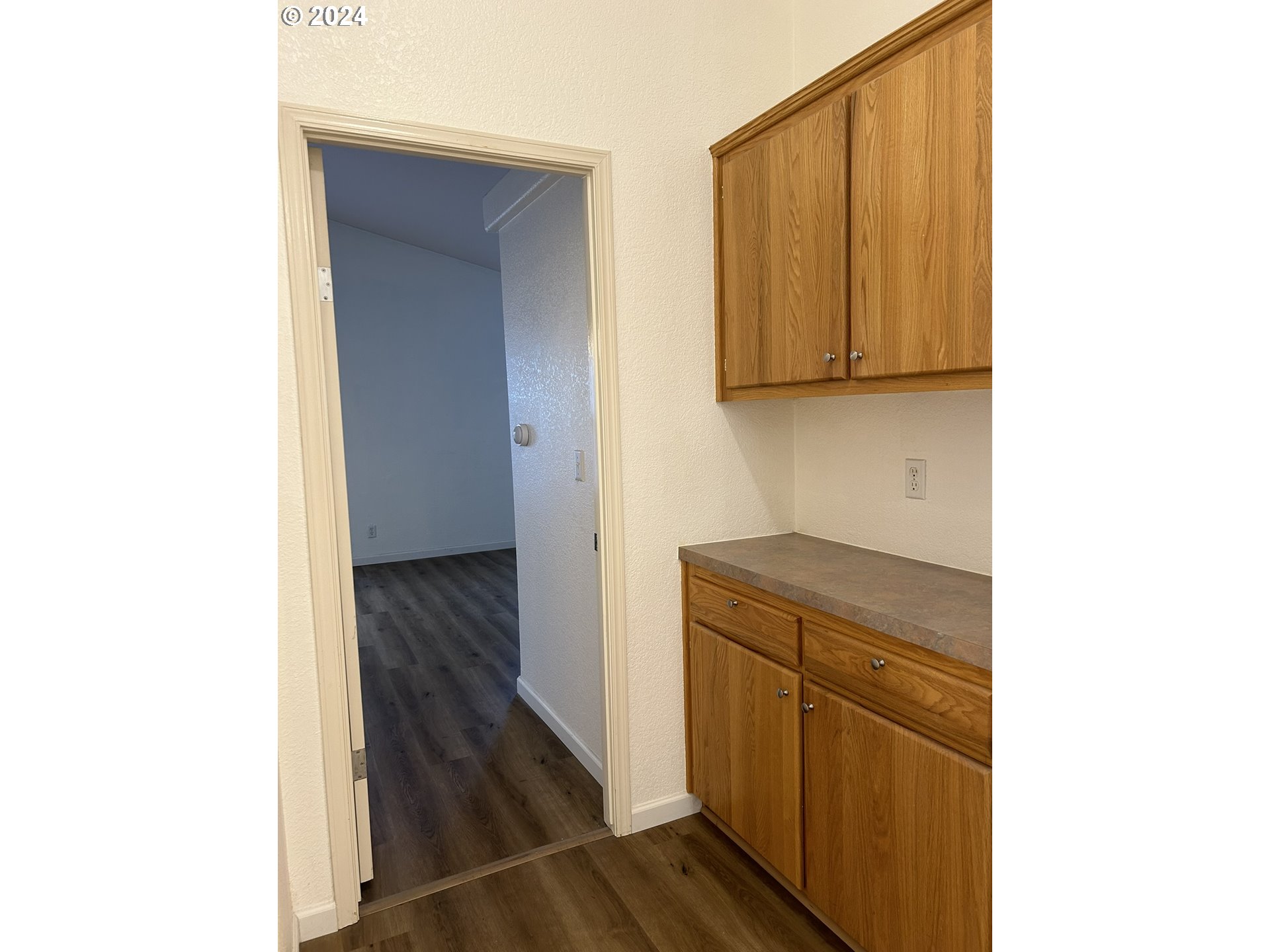 853 Munsel Creek Loop Florence, OR 97439 - Photo 23 of 44 a kitchen with a sink and cabinets