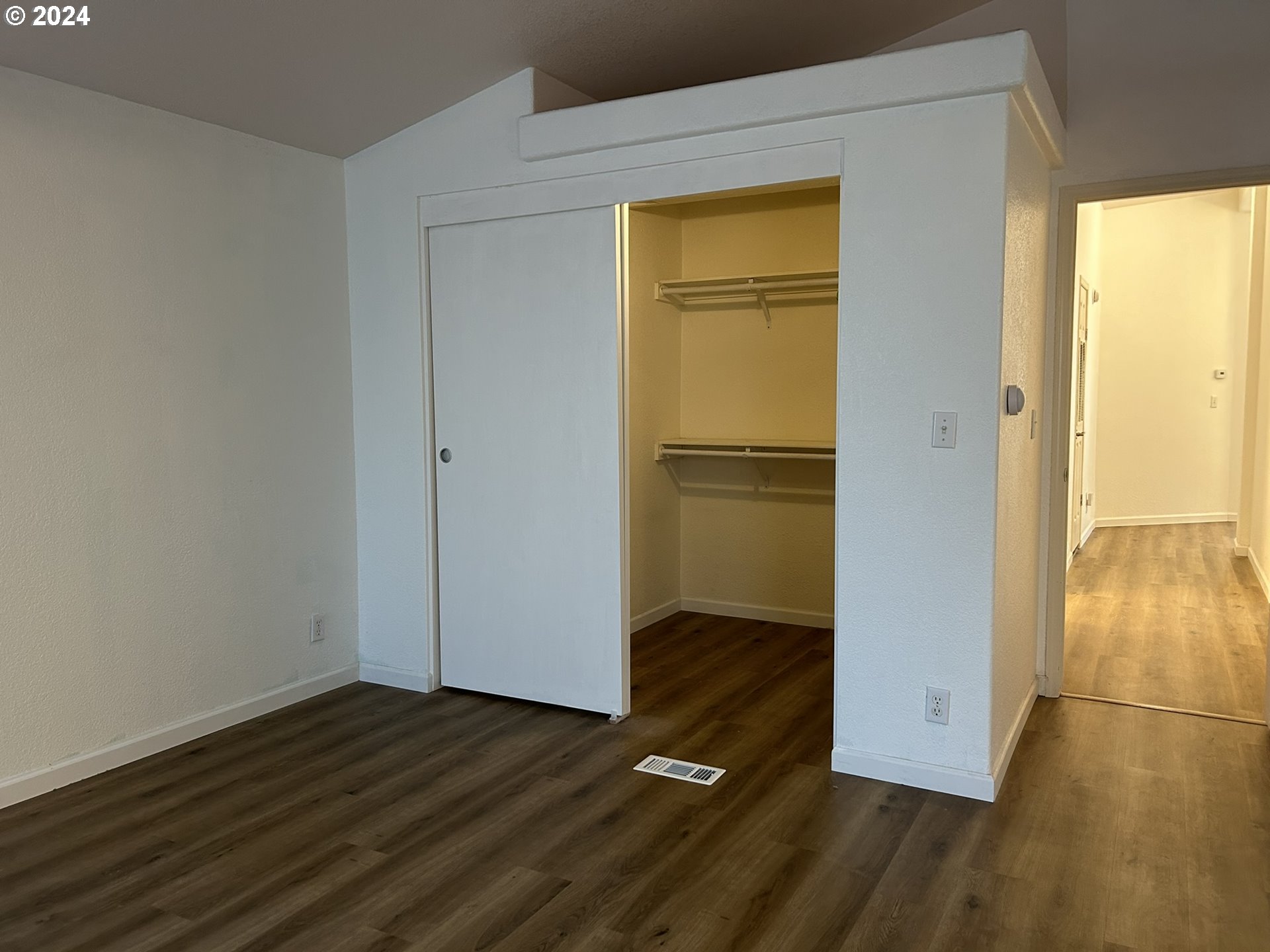 853 Munsel Creek Loop Florence, OR 97439 - Photo 25 of 44 a view of empty room with wooden floor