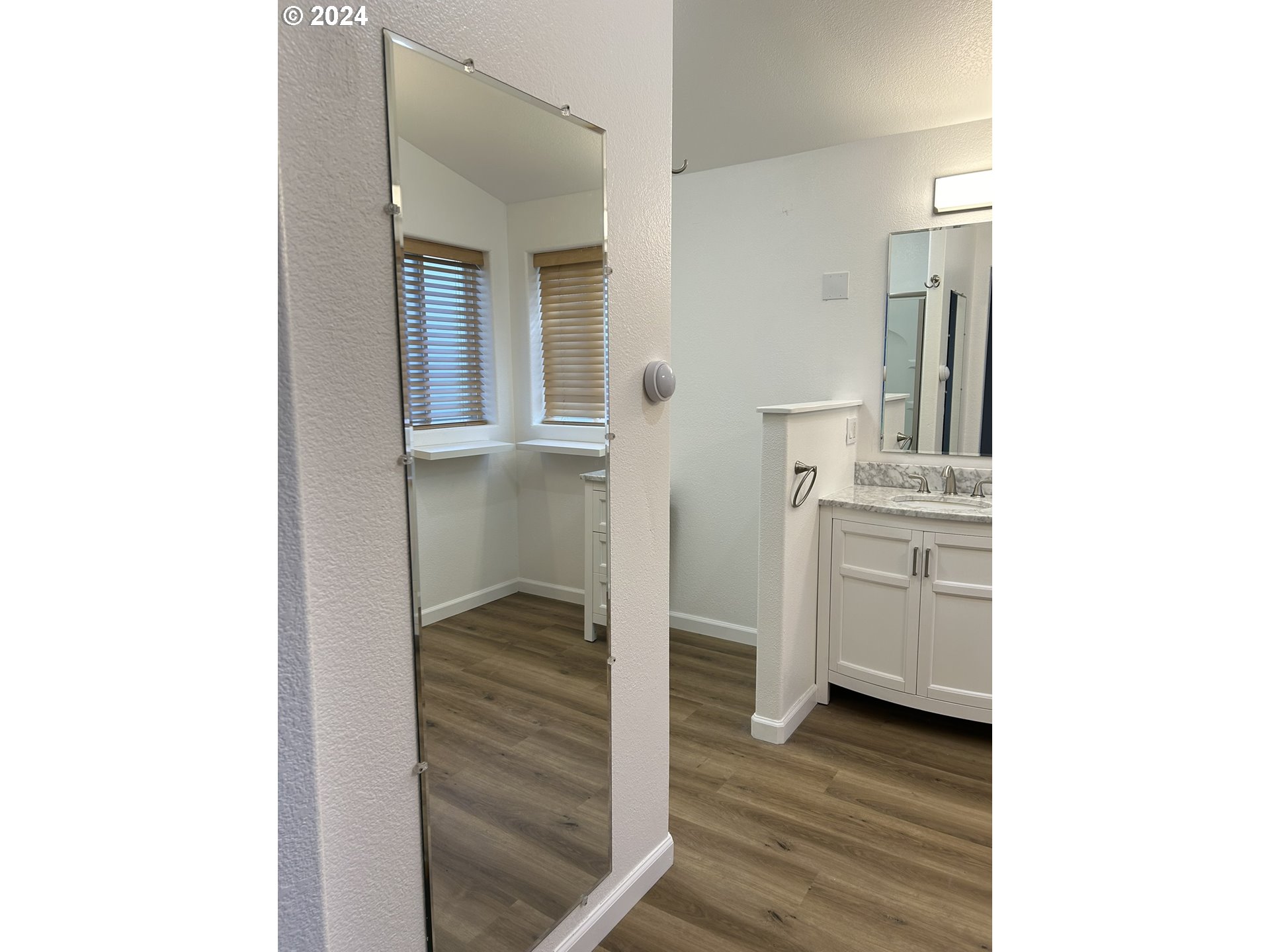 853 Munsel Creek Loop Florence, OR 97439 - Photo 28 of 44 a bathroom with a sink and a mirror