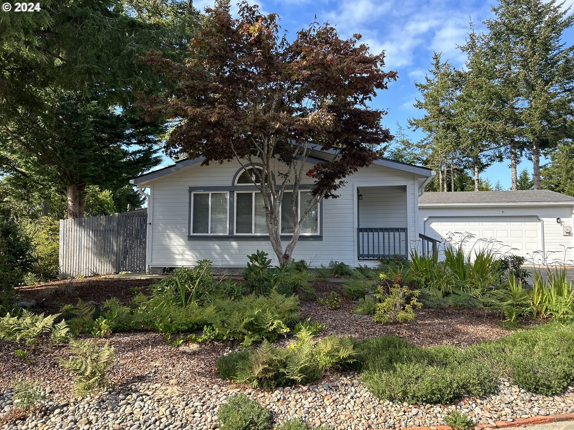 853 Munsel Creek Loop Florence, OR 97439 - Photo 3 of 44 a house view with a outdoor space