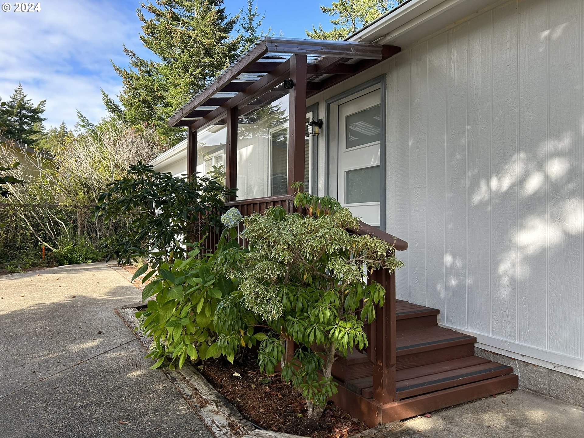 853 Munsel Creek Loop Florence, OR 97439 - Photo 31 of 44 a front view of a house with a yard