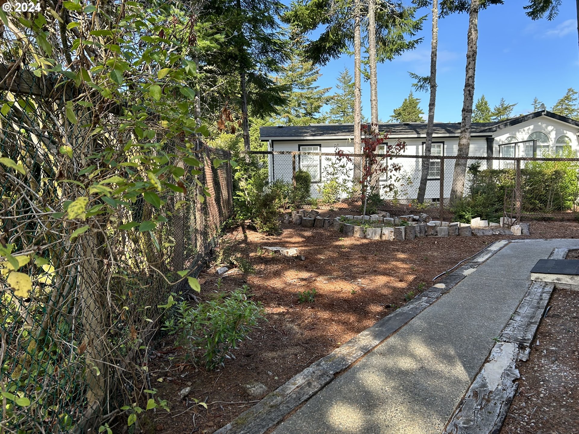 853 Munsel Creek Loop Florence, OR 97439 - Photo 35 of 44 a view of outdoor space yard and patio