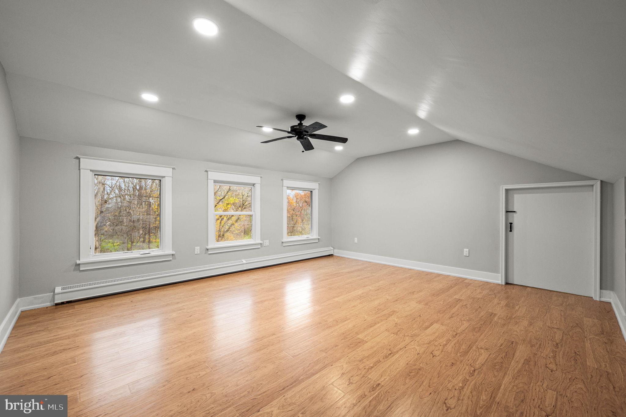 847 Highspire Road Glenmoore, PA 19343 - Photo 12 of 21 a view of an empty room with a window and wooden floor
