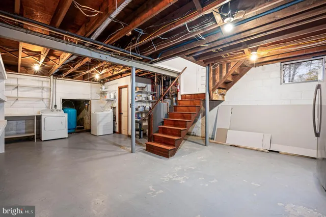 a view of an empty room with white walls