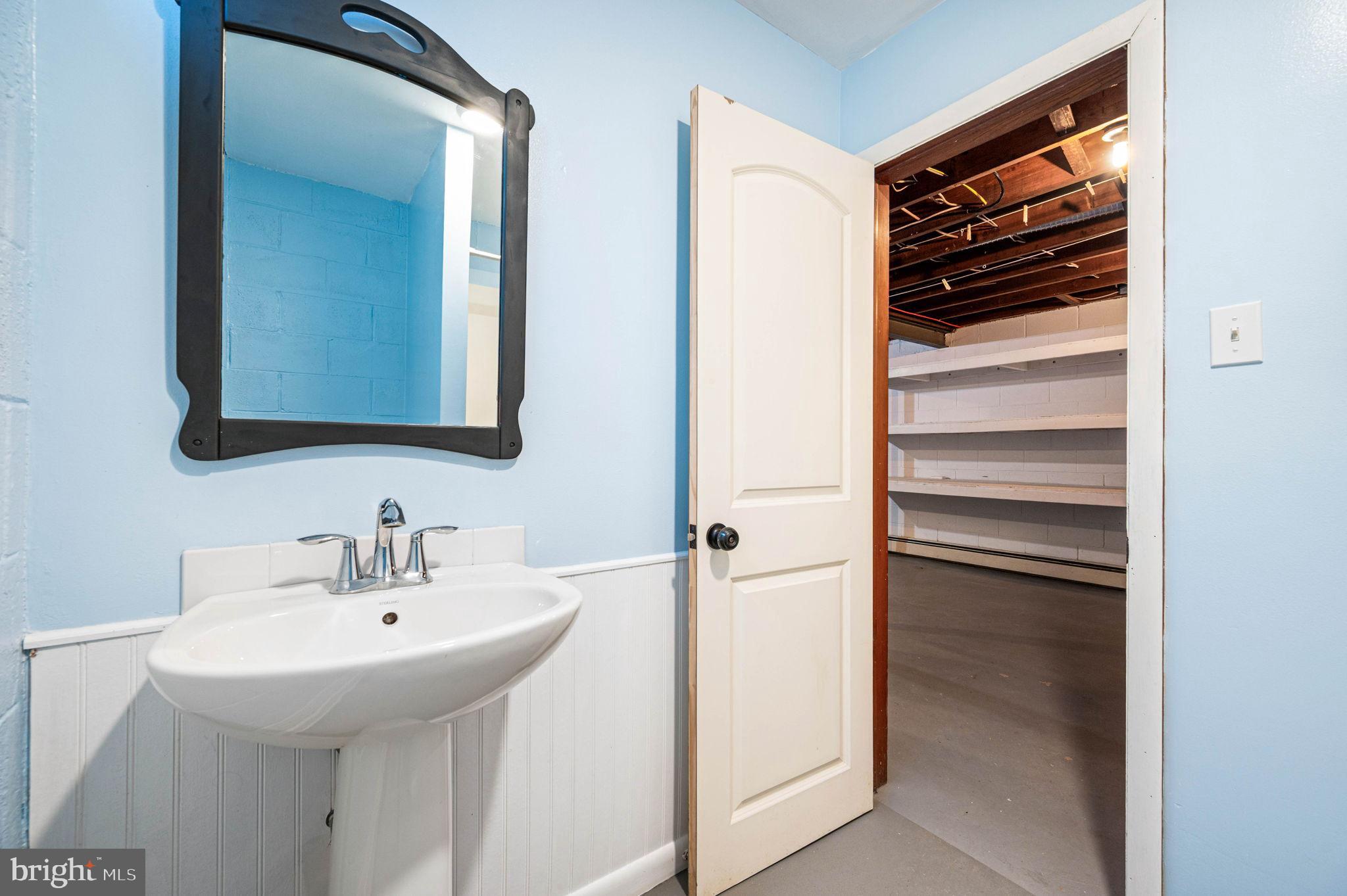 847 Highspire Road Glenmoore, PA 19343 - Photo 17 of 21 a bathroom with a sink and a mirror