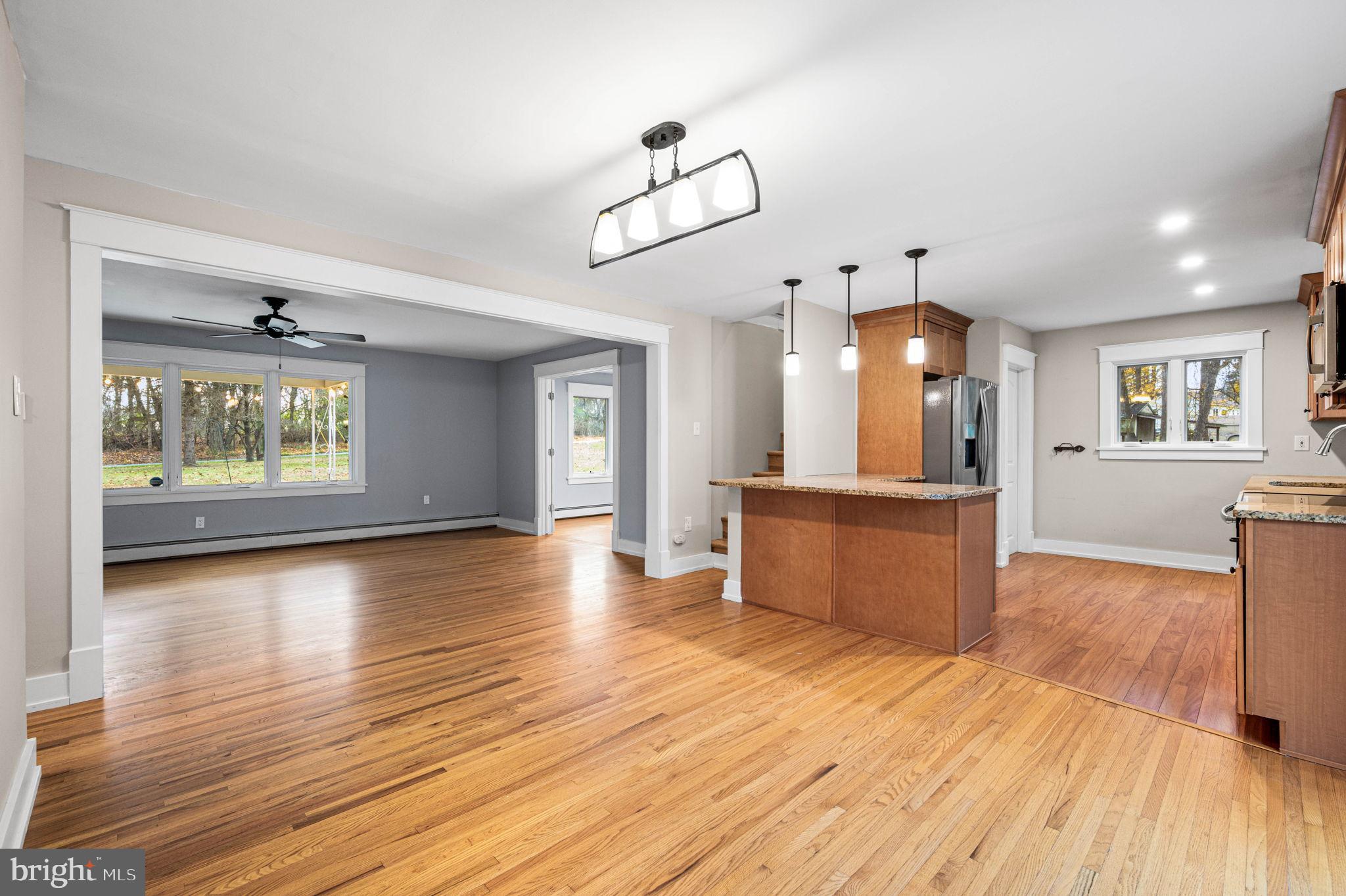 847 Highspire Road Glenmoore, PA 19343 - Photo 6 of 21 a view of a room with wooden floor and a kitchen