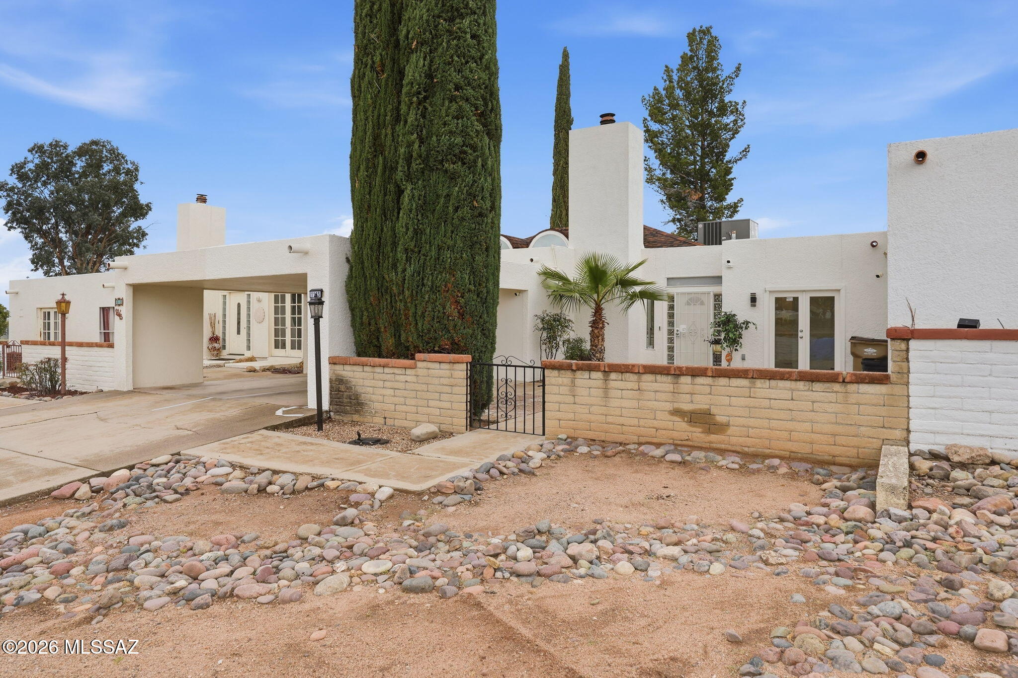 1183 Circulo Canario Rio Rico, AZ 85648 - Photo 27 of 31 front view of a house with a small yard
