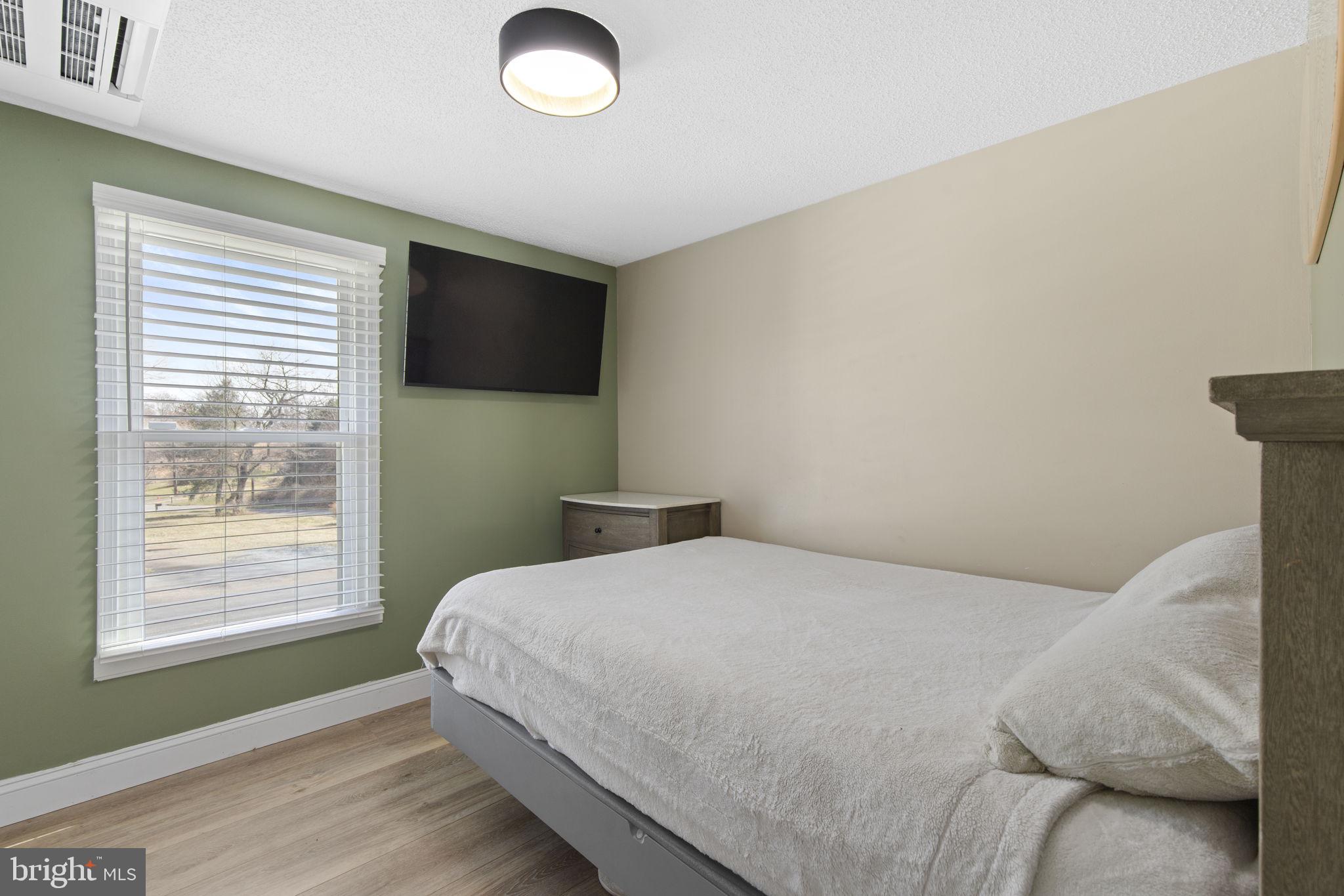 1 Highview Road Conowingo, MD 21918 - Photo 18 of 54 a bedroom with a bed and a flat screen tv