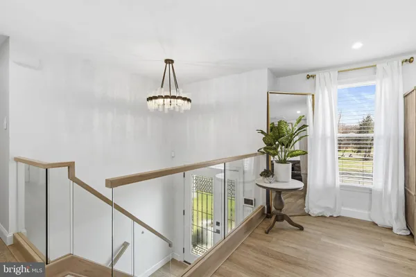 a view of a livingroom with furniture and a window