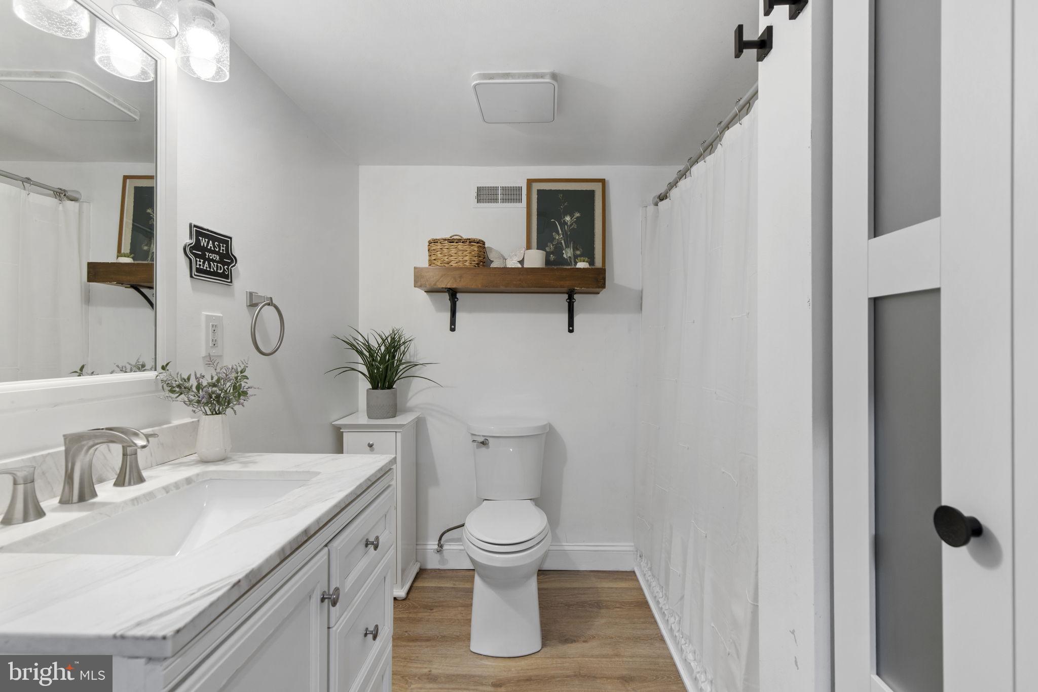 1 Highview Road Conowingo, MD 21918 - Photo 31 of 54 a bathroom with a toilet sink and mirror