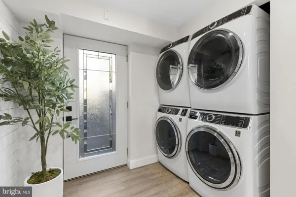 a view of balcony with wooden floor and fence