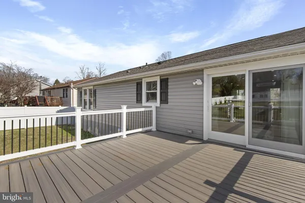 a view of a garden with a bench in the middle
