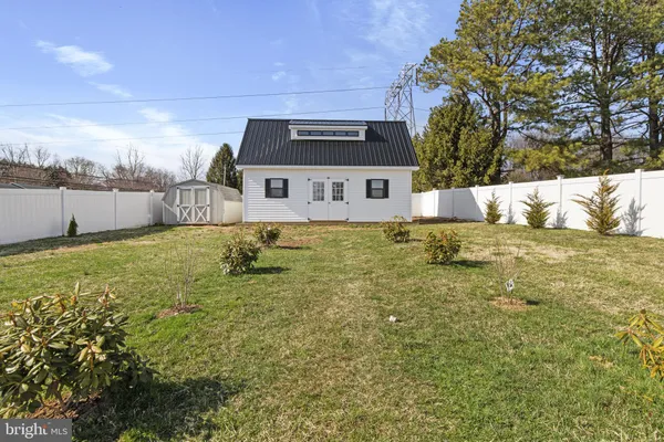 a view of a backyard with swimming pool