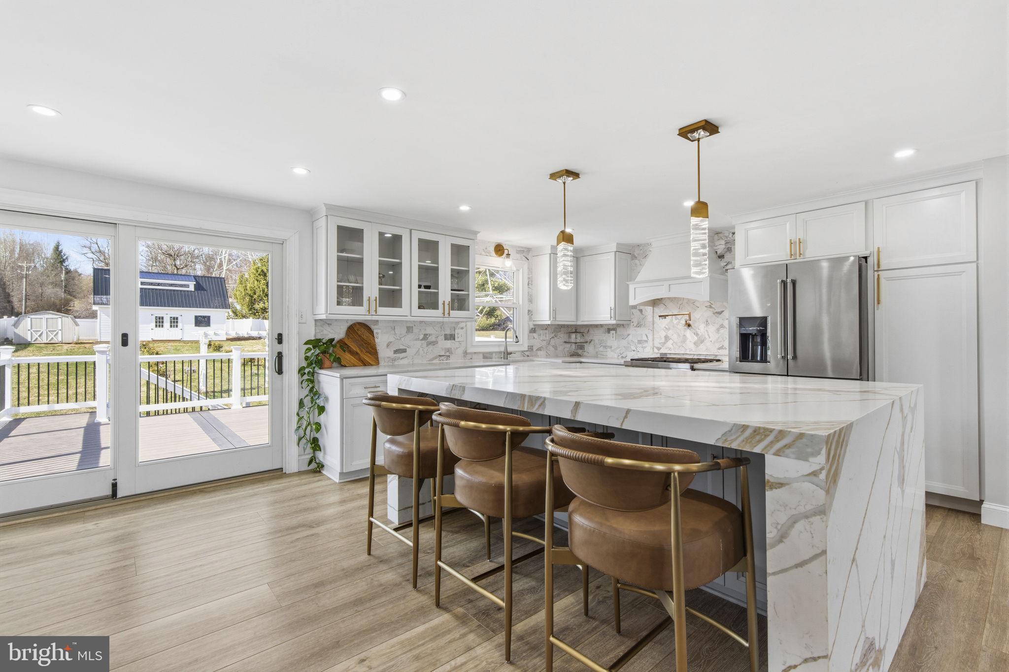 1 Highview Road Conowingo, MD 21918 - Photo 6 of 54 a kitchen with stainless steel appliances granite countertop wooden floor window and cabinets