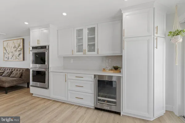 a kitchen with stainless steel appliances granite countertop a stove and a refrigerator