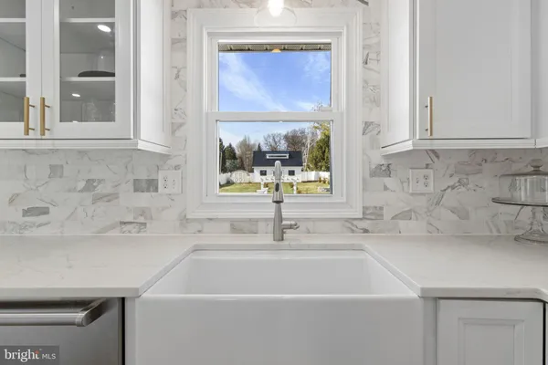 a bathroom with a sink and a window