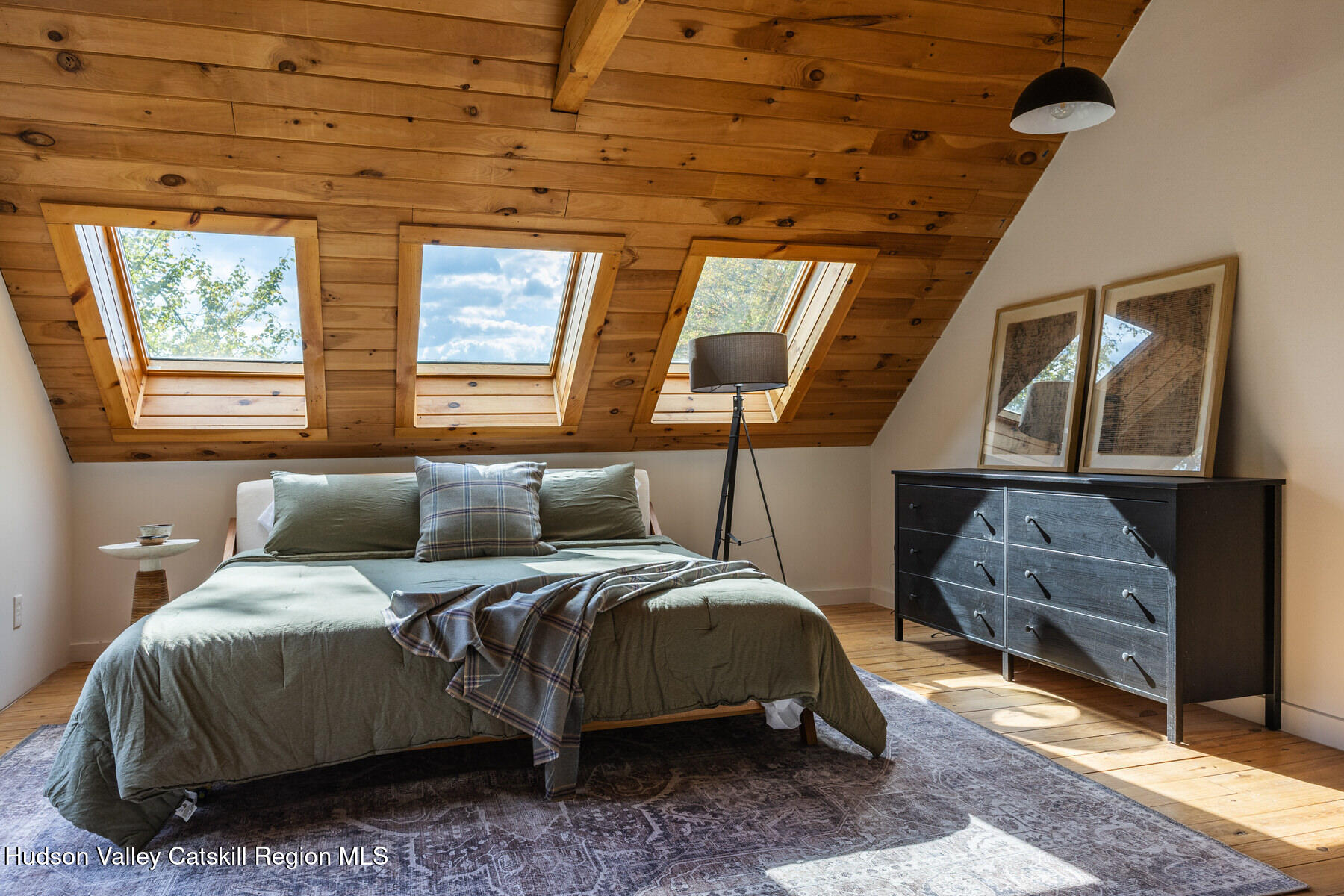 209 Alder Pond Road Andes, NY 13731 - Photo 19 of 32 a bedroom with a bed and wooden floor