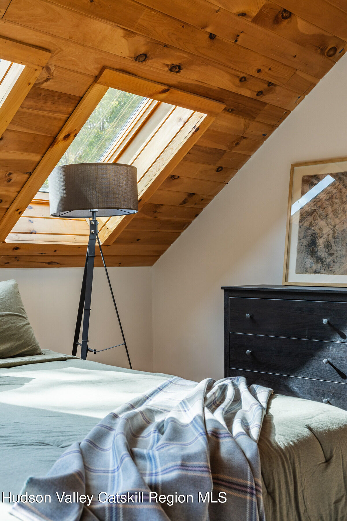 209 Alder Pond Road Andes, NY 13731 - Photo 21 of 32 a bed room with a bed and a painting on the wall