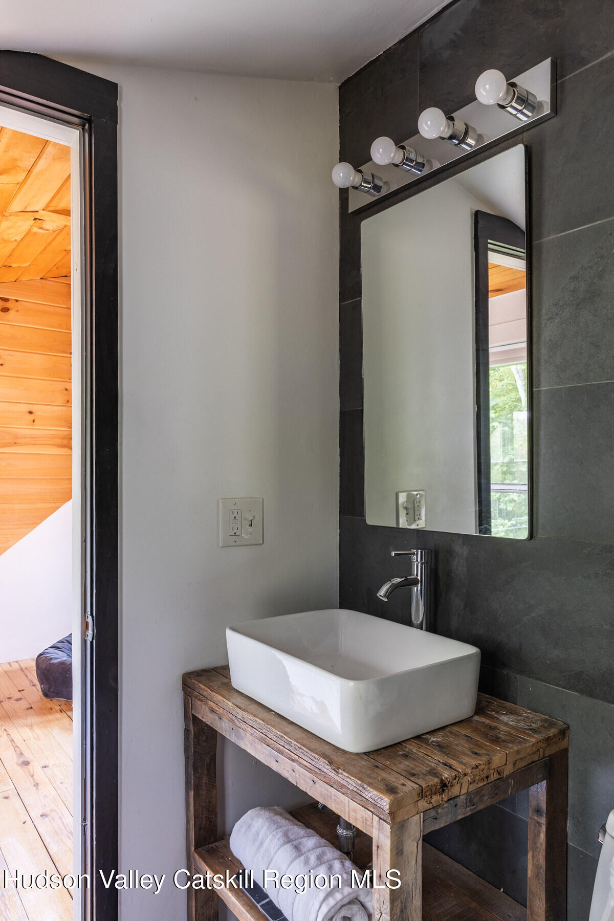 209 Alder Pond Road Andes, NY 13731 - Photo 23 of 32 a bathroom with a granite countertop sink and a mirror