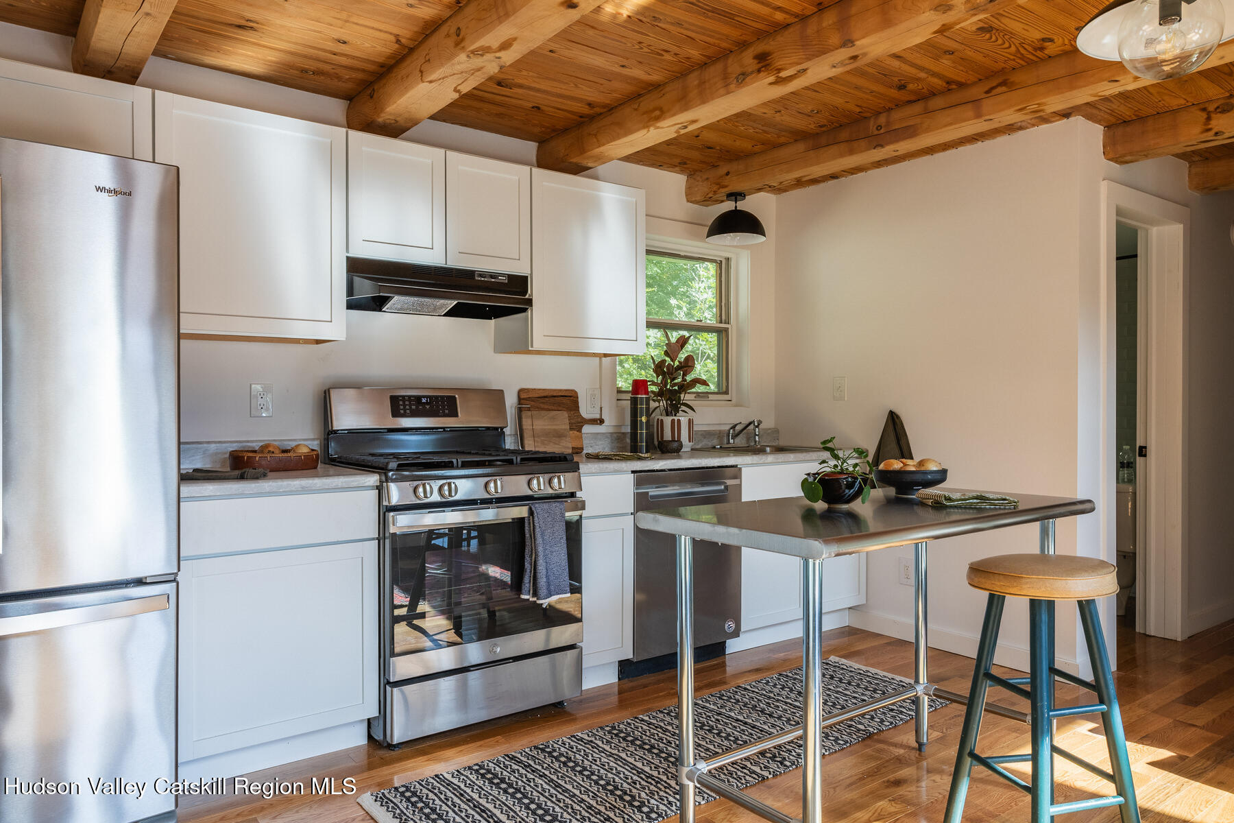 209 Alder Pond Road Andes, NY 13731 - Photo 9 of 32 a kitchen with stainless steel appliances granite countertop a stove a refrigerator and a stove top oven