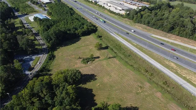 a backyard of a house with a yard with outdoor seating