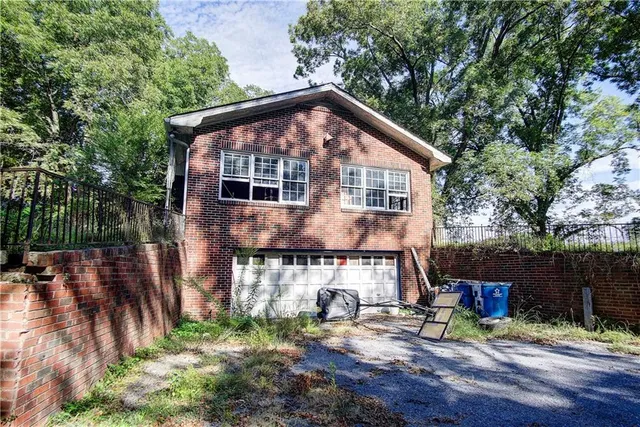 a sign broad on a brick wall