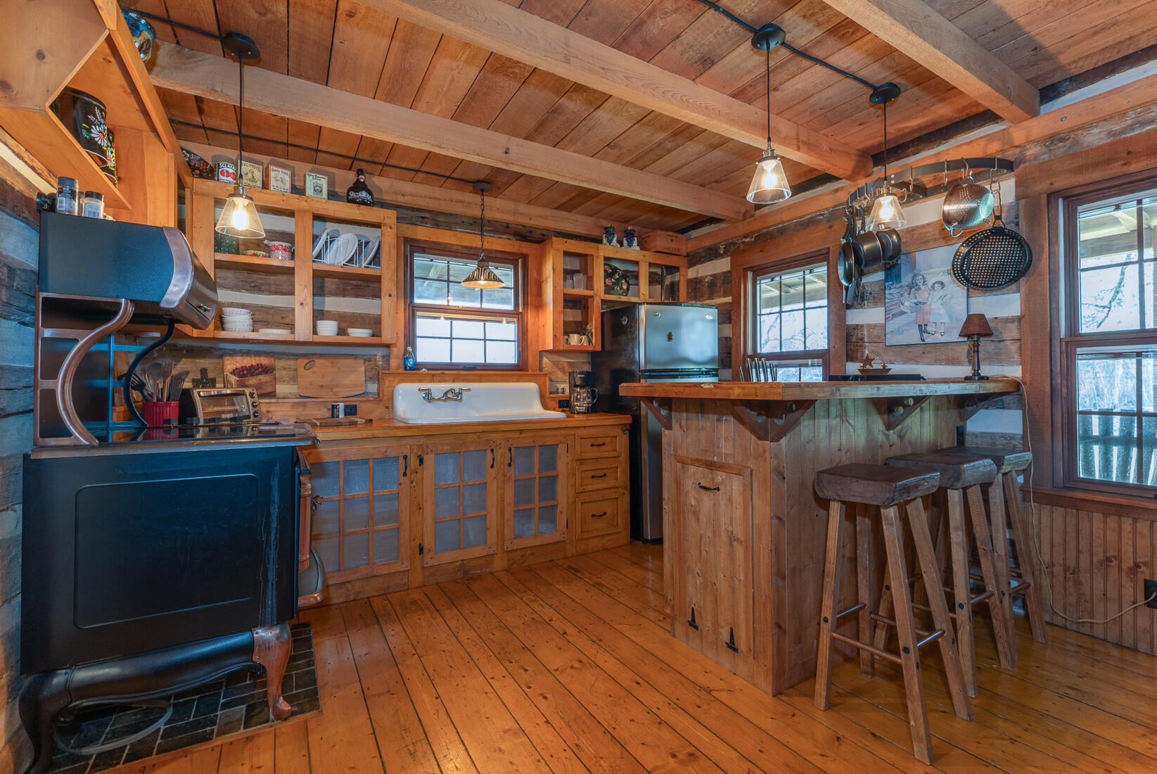 6102 Jennings Creek Road Buchanan, VA 24066 - Photo 21 of 79 a kitchen with a sink and wooden cabinets