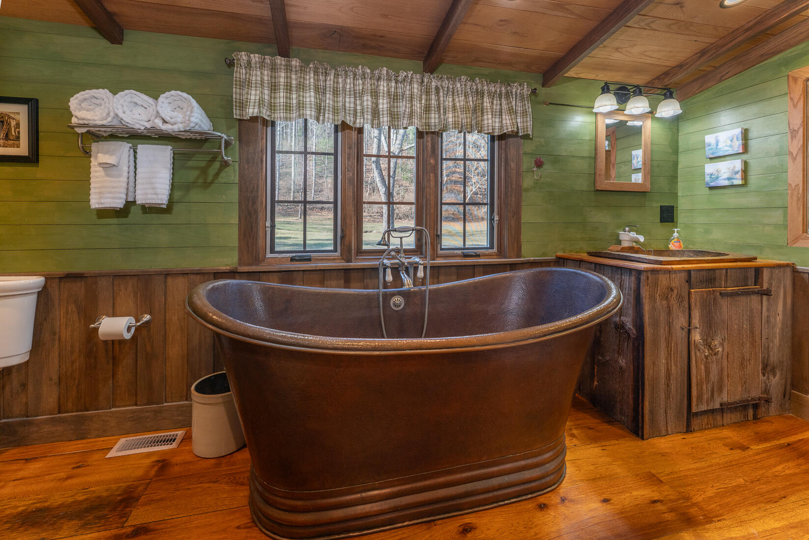 6102 Jennings Creek Road Buchanan, VA 24066 - Photo 46 of 79 a bath tub sitting in a bathroom next to a window